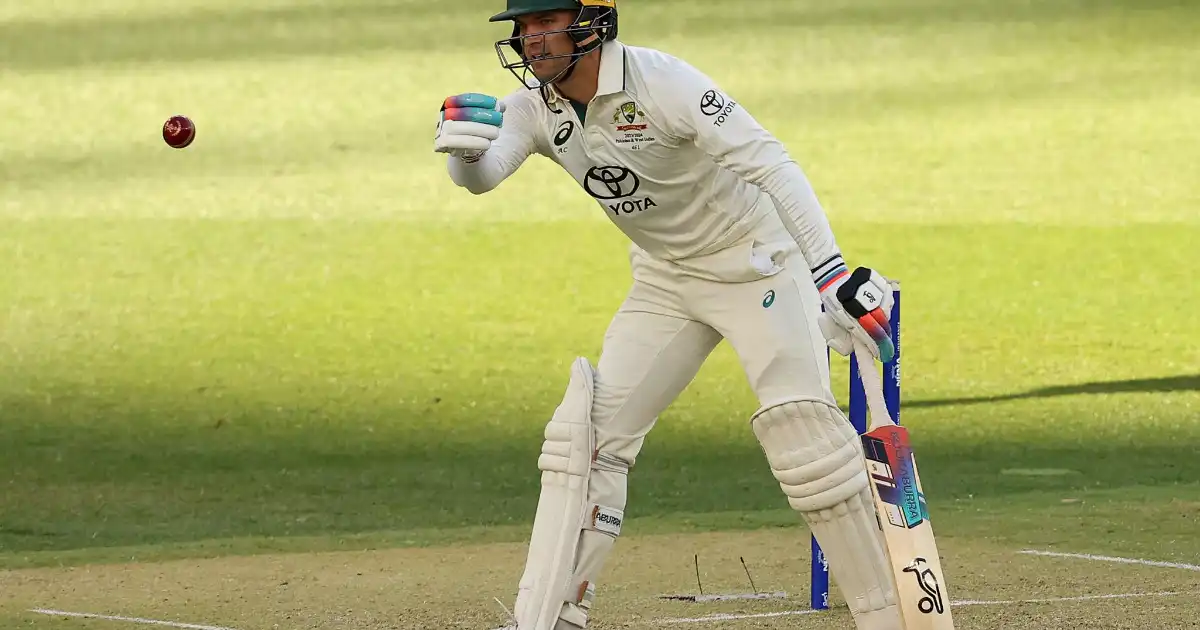 Alex Carey wicketkeeping for Australia during a Test match.